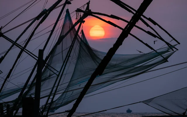 Chinese fishing nets at sunset in Fort Kochi