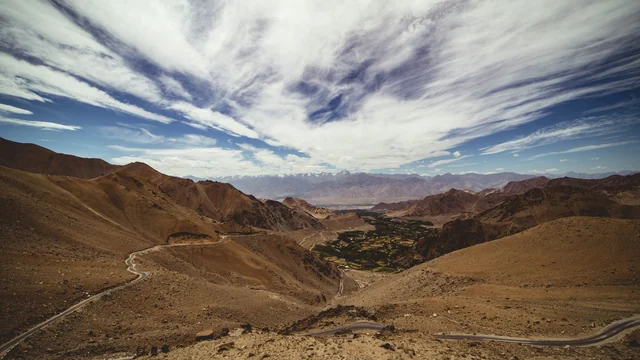 Leh town and the surrounding mountains viewed from the Khardung La road