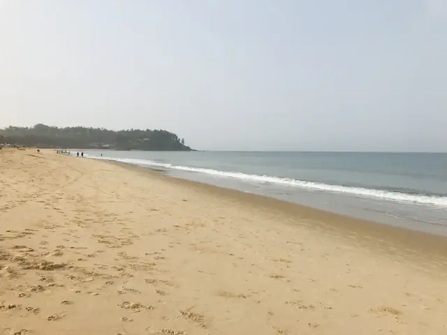 Sandy beach and waves in Goa